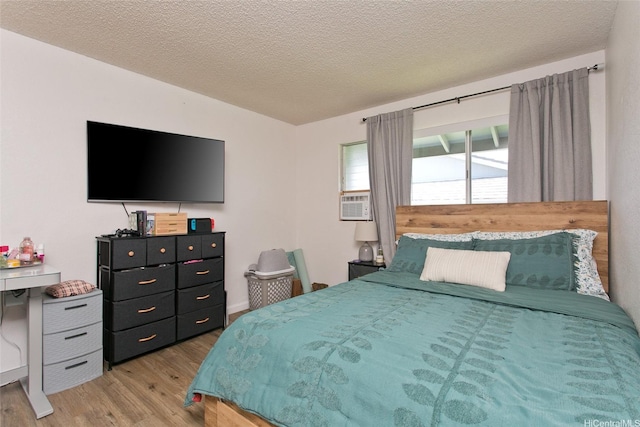 94-1045 Paha Pl Unit T7, Waipahu, HI 96797 - bedroom featuring wood finished floors and a textured ceiling