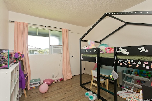 94-1045 Paha Pl Unit T7, Waipahu, HI 96797 - bedroom with wood finished floors and a textured ceiling
