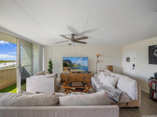 95-31 Kuahelani Ave Unit 439, Mililani, HI 96789 - living room with dark wood-type flooring, ceiling fan, and baseboards