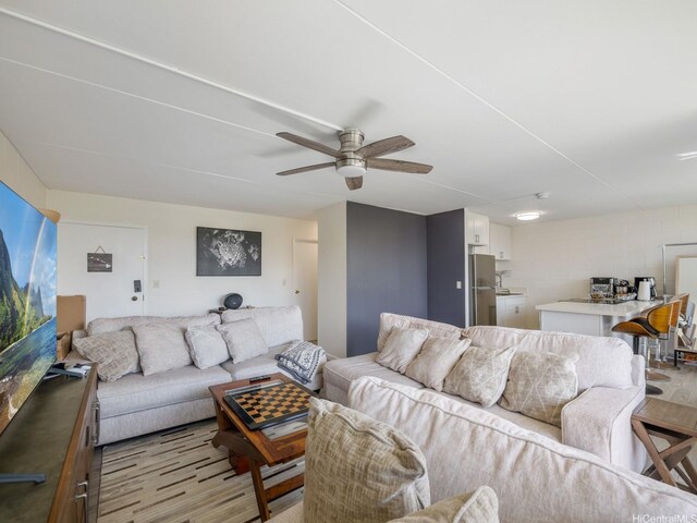 95-31 Kuahelani Ave Unit 439, Mililani, HI 96789 - living room featuring ceiling fan and light wood-style floors