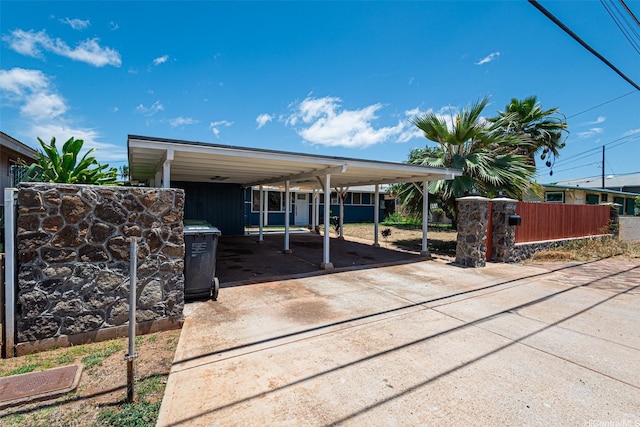 91-517 Pohakupuna Rd, Ewa Beach, HI 96706 - view of patio with concrete driveway and a carport