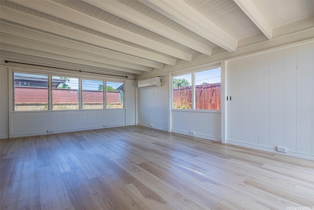 91-517 Pohakupuna Rd, Ewa Beach, HI 96706 - unfurnished room featuring light wood-type flooring, a wall mounted air conditioner, and beam ceiling