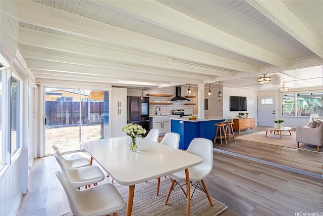 91-517 Pohakupuna Rd, Ewa Beach, HI 96706 - dining space with beam ceiling and light wood-style floors