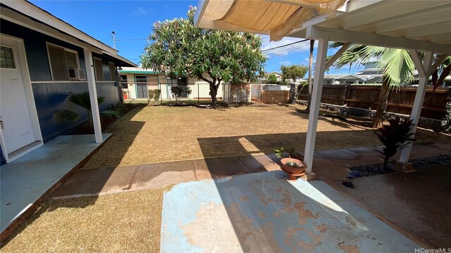 91-517 Pohakupuna Rd, Ewa Beach, HI 96706 - fenced backyard with a patio area
