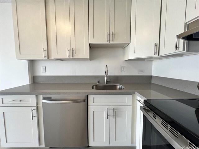 909 Ala Lilikoi St Unit 505, Honolulu, HI 96818 - kitchen featuring dishwasher, electric stove, white cabinetry, and exhaust hood