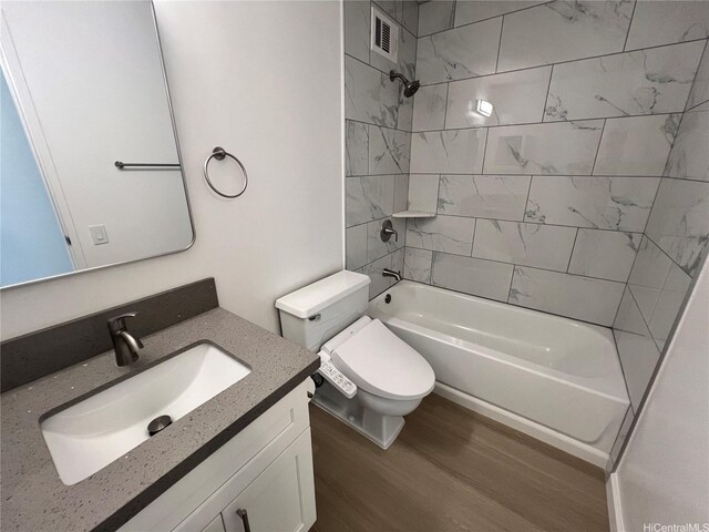 909 Ala Lilikoi St Unit 505, Honolulu, HI 96818 - bathroom featuring wood finished floors, shower / tub combination, and vanity