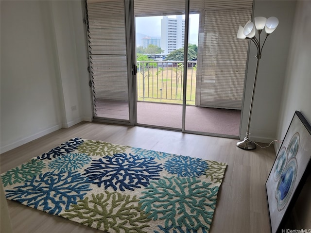 909 Ala Lilikoi St Unit 505, Honolulu, HI 96818 - dining room featuring wood finished floors and baseboards
