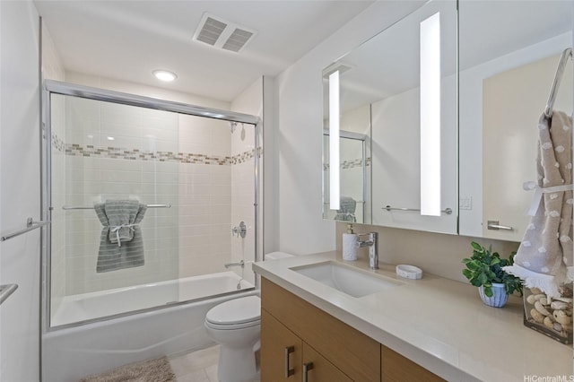555 S St Unit 2201, Honolulu, HI 96813 - bathroom with vanity, bath / shower combo with glass door, toilet, tile patterned flooring, and recessed lighting