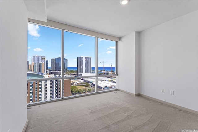 555 S St Unit 2201, Honolulu, HI 96813 - empty room featuring carpet flooring, a water view, baseboards, and a view of city