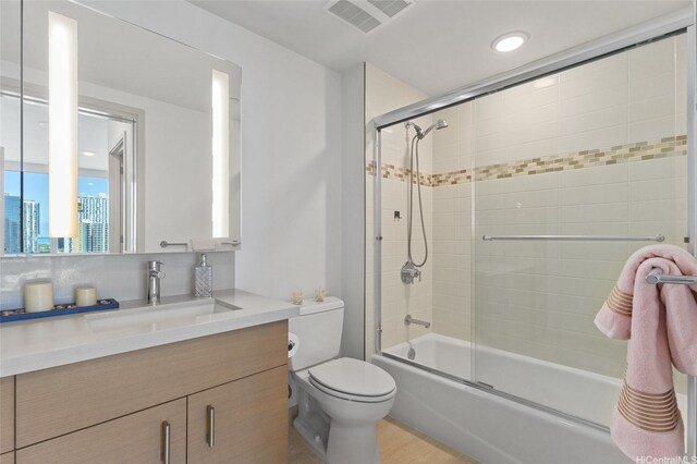 555 S St Unit 2201, Honolulu, HI 96813 - full bathroom featuring vanity, toilet, and combined bath / shower with glass door