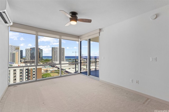 555 S St Unit 2201, Honolulu, HI 96813 - unfurnished room with a wall mounted air conditioner, carpet flooring, a water view, and ceiling fan