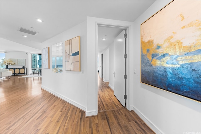 1288 Ala Moana Blvd Unit 21A, Honolulu, HI 96814 - hallway featuring wood finished floors, recessed lighting, and lofted ceiling