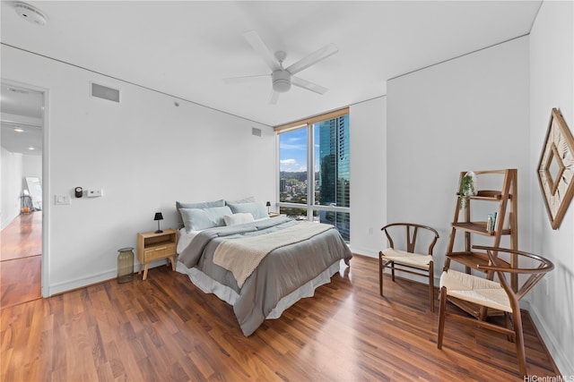 1288 Ala Moana Blvd Unit 21A, Honolulu, HI 96814 - bedroom featuring expansive windows, wood finished floors, and ceiling fan