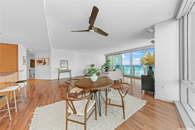 1288 Ala Moana Blvd Unit 21A, Honolulu, HI 96814 - dining space with a ceiling fan and light wood finished floors