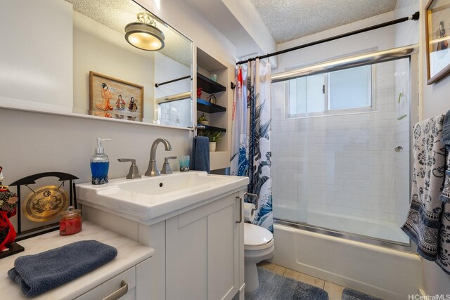 1111 Wilder Ave Unit 14B, Honolulu, HI 96822 - bathroom with combined bath / shower with glass door, vanity, a textured ceiling, and tile patterned flooring