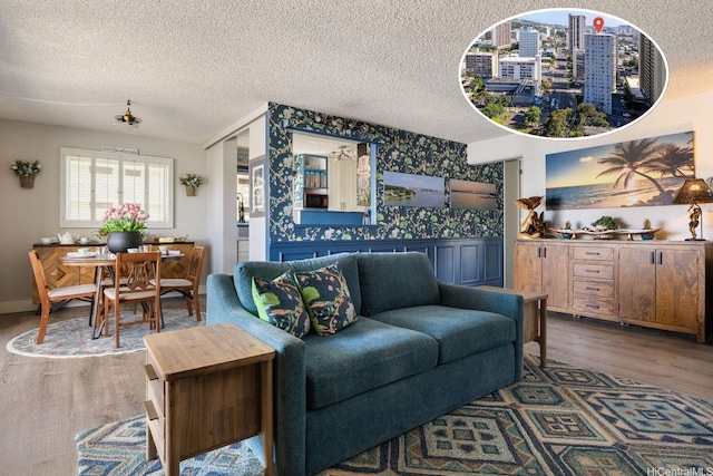 1111 Wilder Ave Unit 14B, Honolulu, HI 96822 - living room featuring wood finished floors, wallpapered walls, and a textured ceiling