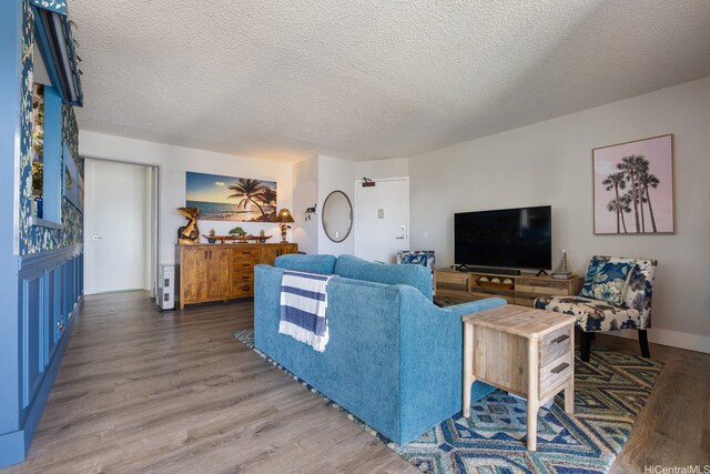 1111 Wilder Ave Unit 14B, Honolulu, HI 96822 - living room with wood finished floors and a textured ceiling