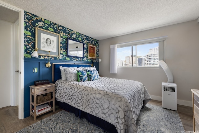 1111 Wilder Ave Unit 14B, Honolulu, HI 96822 - bedroom featuring wallpapered walls, wood finished floors, and a textured ceiling