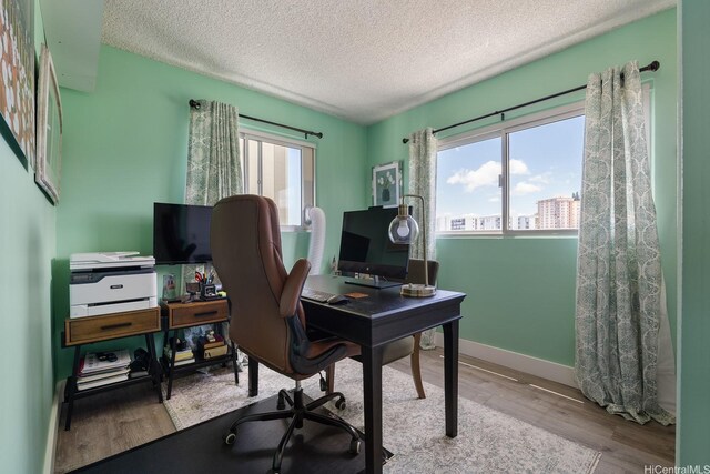 1111 Wilder Ave Unit 14B, Honolulu, HI 96822 - office area with wood finished floors and a textured ceiling