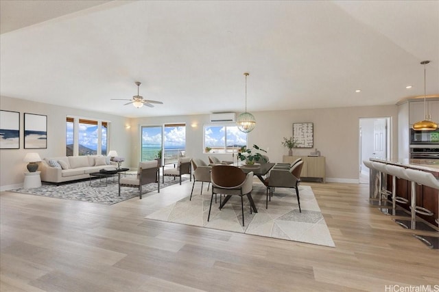 1062 Hoa St, Honolulu, HI 96825 - dining area with a wall unit AC, light wood-type flooring, baseboards, recessed lighting, and a ceiling fan