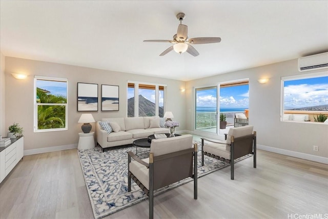 1062 Hoa St, Honolulu, HI 96825 - living area with light wood-type flooring, ceiling fan, baseboards, and a wall unit AC