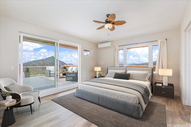 1062 Hoa St, Honolulu, HI 96825 - bedroom featuring a wall unit AC, access to exterior, light wood-type flooring, and ceiling fan