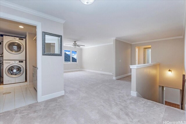 1062 Hoa St, Honolulu, HI 96825 - laundry area with estacked washer and dryer, carpet, baseboards, crown molding, and a ceiling fan