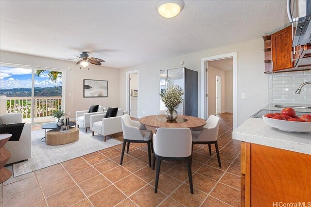 1062 Hoa St, Honolulu, HI 96825 - dining space featuring light tile patterned floors and ceiling fan