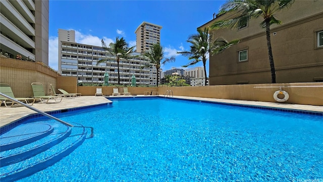 2121 Ala Wai Blvd Unit 1603, Honolulu, HI 96815 - community pool with a patio area and a view of city