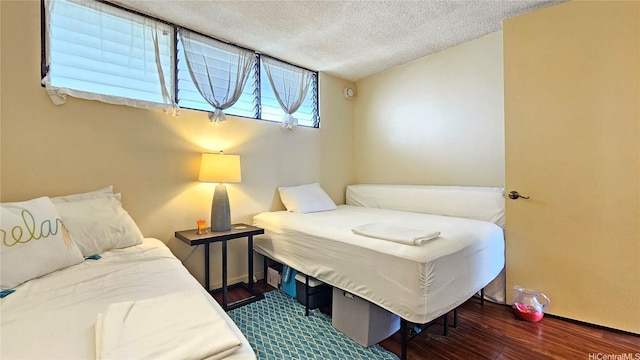 2121 Ala Wai Blvd Unit 1603, Honolulu, HI 96815 - bedroom featuring wood finished floors and a textured ceiling