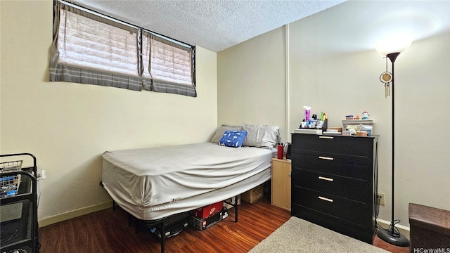 2121 Ala Wai Blvd Unit 1603, Honolulu, HI 96815 - bedroom featuring wood finished floors, baseboards, and a textured ceiling
