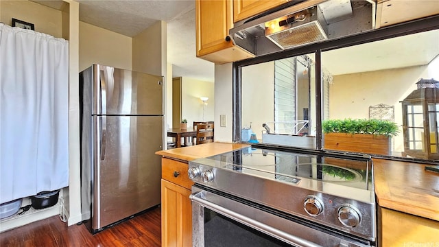 2121 Ala Wai Blvd Unit 1603, Honolulu, HI 96815 - kitchen featuring stainless steel appliances, dark wood-style flooring, ventilation hood, and brown cabinets