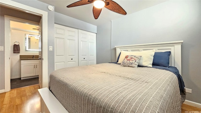 1717 Ala Wai Blvd Unit 2002, Honolulu, HI 96815 - bedroom featuring light wood-type flooring, a closet, baseboards, and a ceiling fan