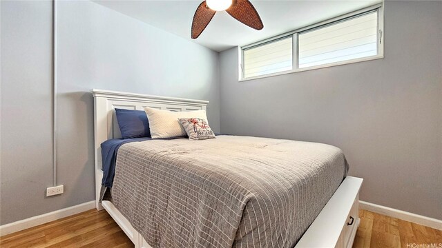 1717 Ala Wai Blvd Unit 2002, Honolulu, HI 96815 - bedroom featuring baseboards, light wood-style flooring, and ceiling fan