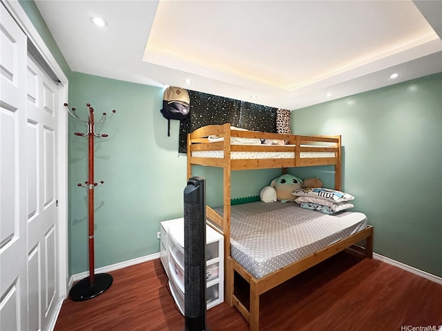5210 Likini St Unit 810, Honolulu, HI 96818 - bedroom with wood finished floors, baseboards, a raised ceiling, and recessed lighting
