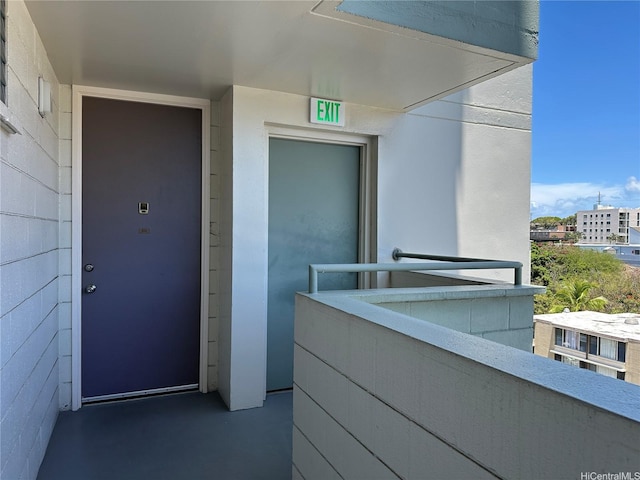 5210 Likini St Unit 810, Honolulu, HI 96818 - view of exterior entry with a balcony