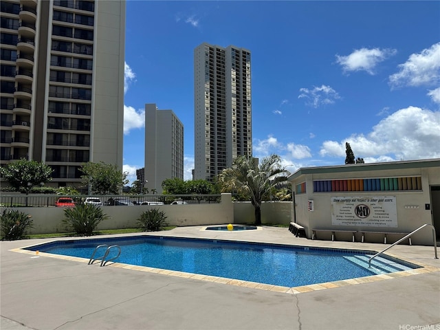 5210 Likini St Unit 810, Honolulu, HI 96818 - community pool with a patio and a view of city