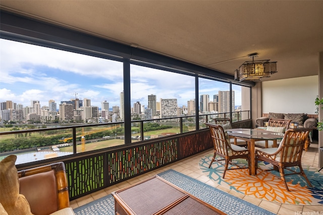 583 Kamoku St Unit Dh2303, Honolulu, HI 96826 - sunroom / solarium featuring a skyline view and a chandelier