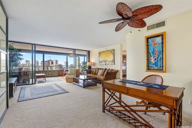 583 Kamoku St Unit Dh2303, Honolulu, HI 96826 - living room with carpet flooring, expansive windows, a skyline view, ceiling fan, and a textured ceiling