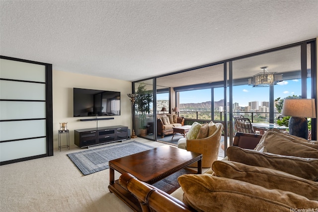 583 Kamoku St Unit Dh2303, Honolulu, HI 96826 - living room featuring a wall of windows, a textured ceiling, and carpet