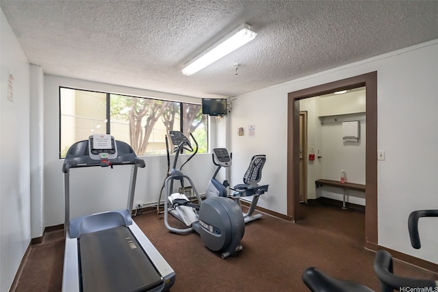 583 Kamoku St Unit Dh2303, Honolulu, HI 96826 - exercise area featuring a textured ceiling and baseboards