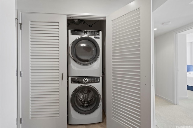 1388 Kapiolani Blvd Unit 3701, Honolulu, HI 96814 - laundry area with estacked washer and dryer and carpet flooring