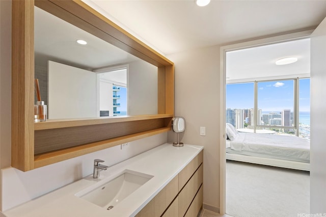 1388 Kapiolani Blvd Unit 3701, Honolulu, HI 96814 - bathroom with vanity, connected bathroom, recessed lighting, and a view of city
