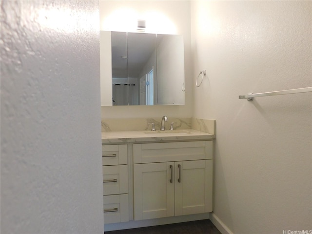 91-1060 Mikohu St Unit 5T, Ewa Beach, HI 96706 - bathroom with vanity and a textured wall