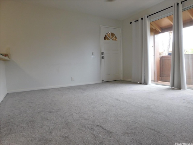 91-1060 Mikohu St Unit 5T, Ewa Beach, HI 96706 - unfurnished living room featuring carpet and baseboards