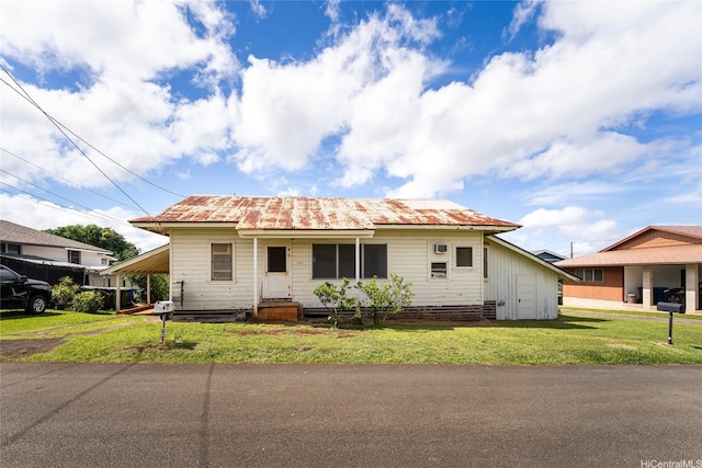 1305 Manua St, Wahiawa, HI 96786 - view of front of home featuring a metal roof, a front lawn, and entry steps