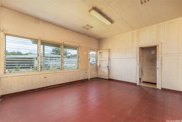 1305 Manua St, Wahiawa, HI 96786 - empty room with dark wood-style floors and wooden walls