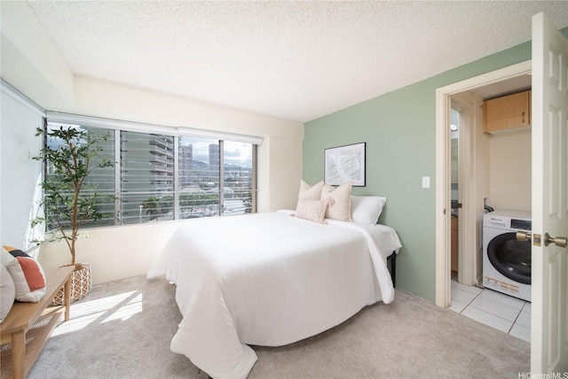 2525 Date St Unit 405, Honolulu, HI 96826 - carpeted bedroom with washer / dryer, a textured ceiling, and tile patterned flooring