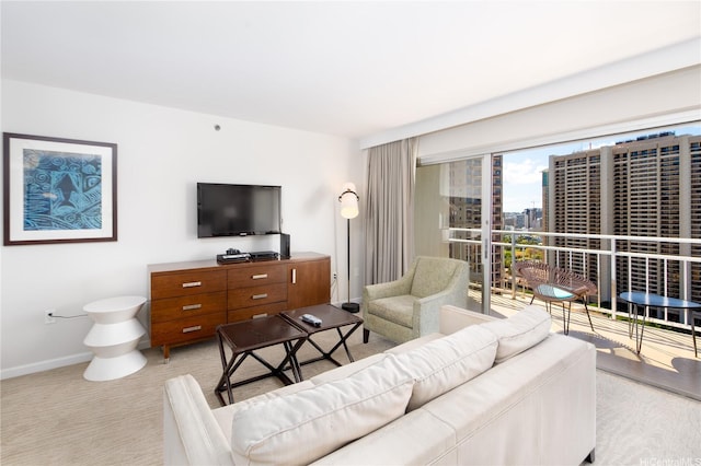 1777 Ala Moana Blvd Unit 2430, Honolulu, HI 96815 - living room with baseboards and light colored carpet