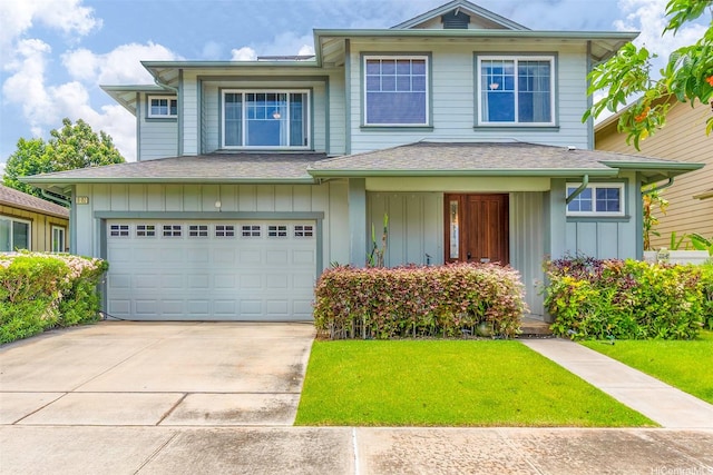 91-1152 Paapaana St, Ewa Beach, HI 96706 - view of front of home featuring concrete driveway, a front lawn, board and batten siding, and an attached garage